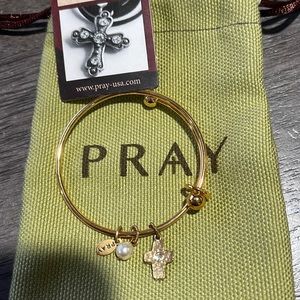 Gold first communionbracelet. New in bag. Never worn. Cross and pearl
